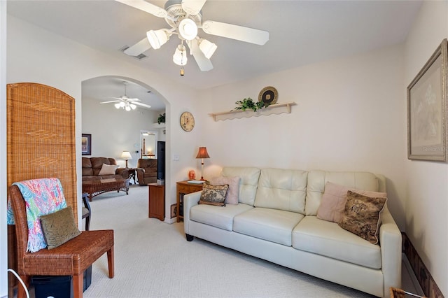 living room with light carpet and ceiling fan