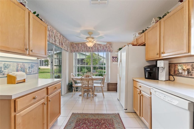 kitchen featuring light tile patterned flooring, light brown cabinets, ceiling fan, and white appliances