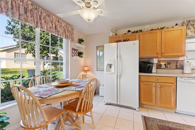 kitchen with light tile patterned floors, white appliances, and ceiling fan