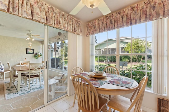 dining area featuring light tile patterned floors and ceiling fan