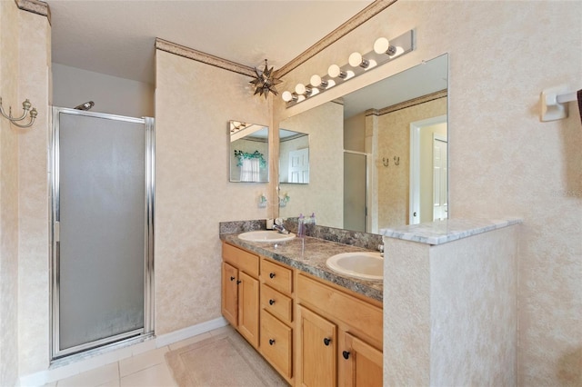 bathroom with vanity, tile patterned floors, and walk in shower