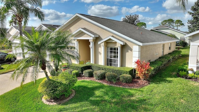 view of side of property featuring a yard