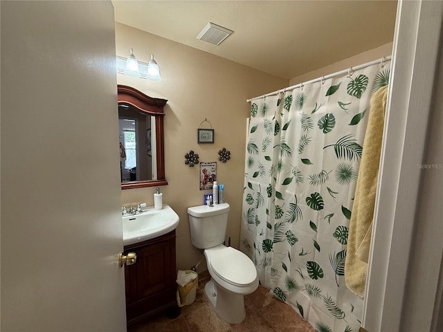 bathroom with vanity, tile patterned flooring, a shower with curtain, and toilet