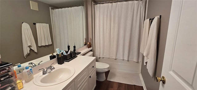 full bathroom with shower / tub combo, vanity, wood-type flooring, and toilet