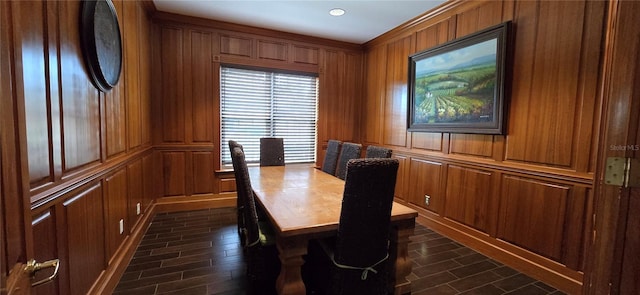 dining area with wood walls