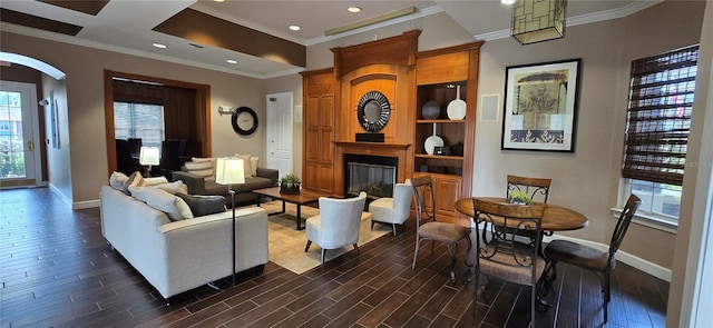 living room featuring ornamental molding and dark hardwood / wood-style flooring