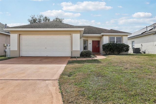 view of front of house featuring a garage, central AC unit, and a front yard