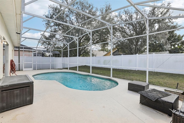 view of swimming pool with a lanai and a patio area