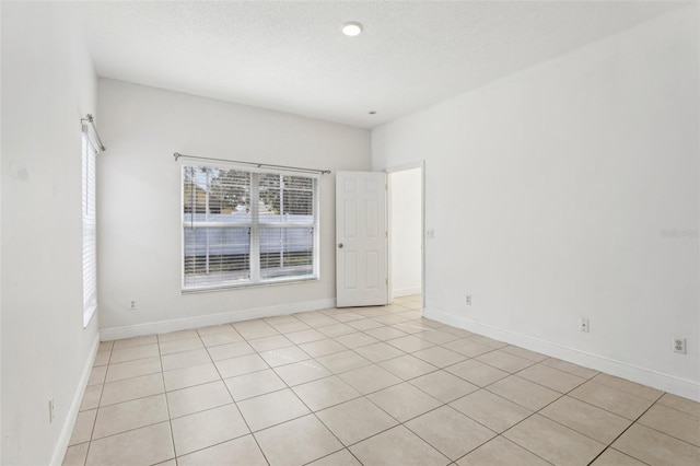 spare room featuring a textured ceiling