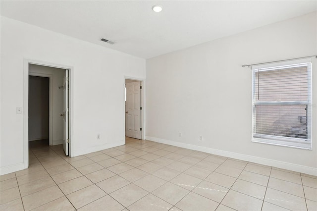 empty room featuring light tile patterned flooring