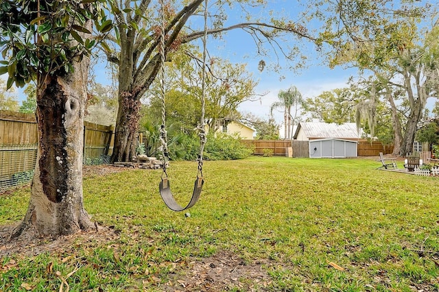 view of yard with an outbuilding and a fenced backyard