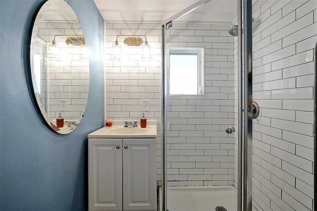 full bath with vanity and a stall shower