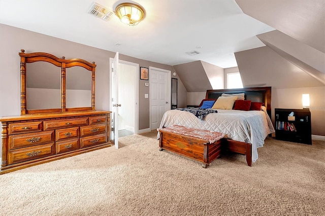 bedroom featuring visible vents, lofted ceiling, carpet, and baseboards