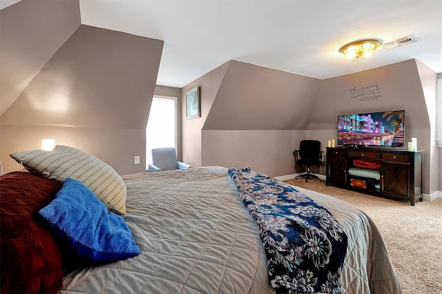 bedroom featuring vaulted ceiling, baseboards, visible vents, and carpet floors