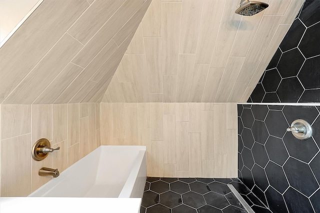 full bath with tile walls