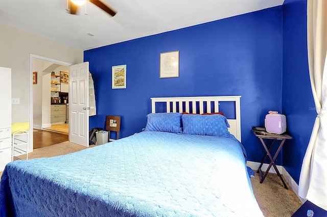 bedroom with baseboards, carpet, and ceiling fan