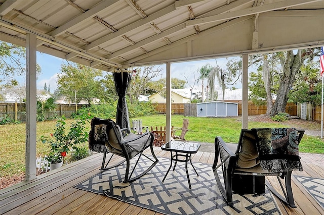 sunroom with lofted ceiling and a healthy amount of sunlight