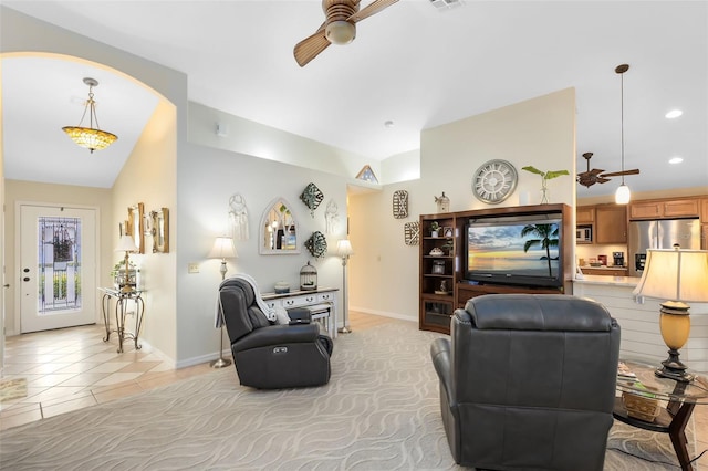 tiled living room featuring lofted ceiling and ceiling fan