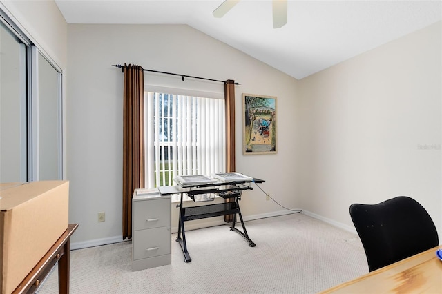 office area featuring light carpet, lofted ceiling, and ceiling fan