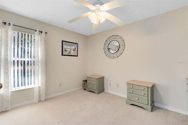 misc room featuring light carpet and ceiling fan