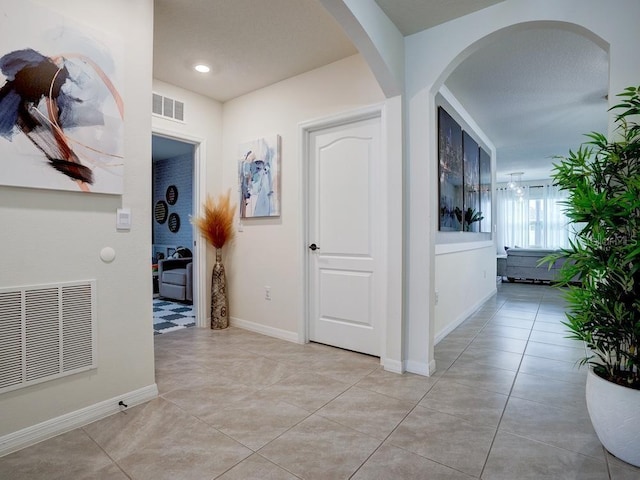 hallway with light tile patterned flooring