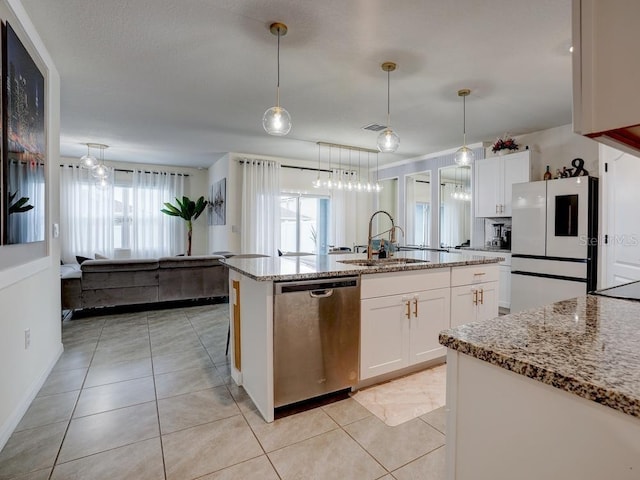 kitchen featuring white cabinetry, dishwasher, sink, and refrigerator