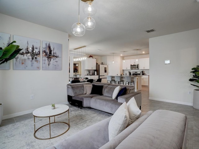 living room featuring light tile patterned floors