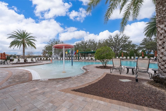 view of swimming pool with a patio area and pool water feature