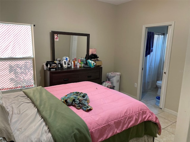 tiled bedroom with connected bathroom