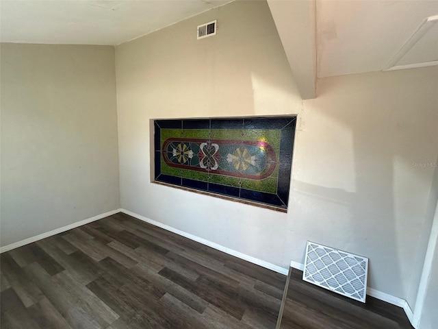 details featuring visible vents, baseboards, and wood finished floors