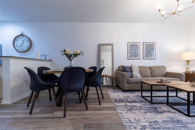 dining room featuring a chandelier and hardwood / wood-style floors