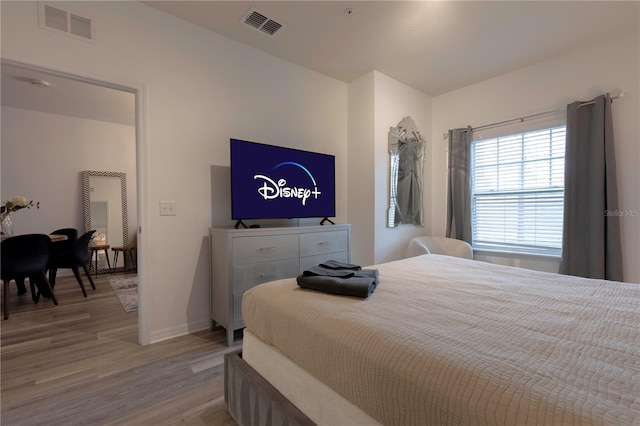 bedroom with light hardwood / wood-style flooring