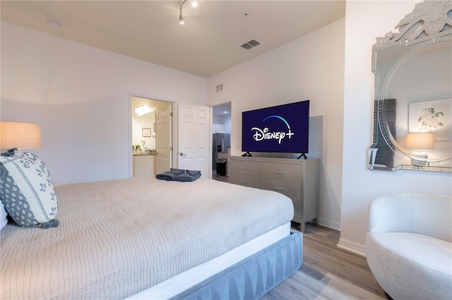 bedroom featuring light hardwood / wood-style floors