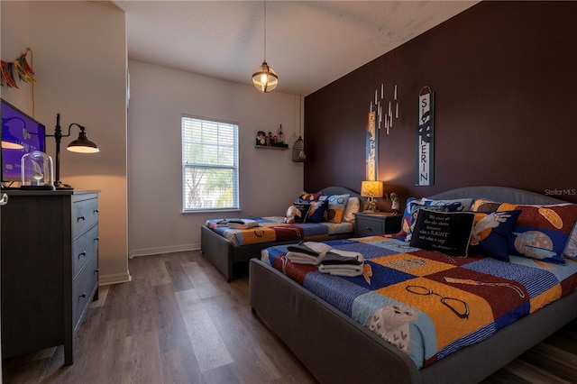 bedroom with wood-type flooring