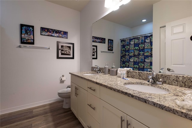 bathroom featuring vanity, wood-type flooring, curtained shower, and toilet