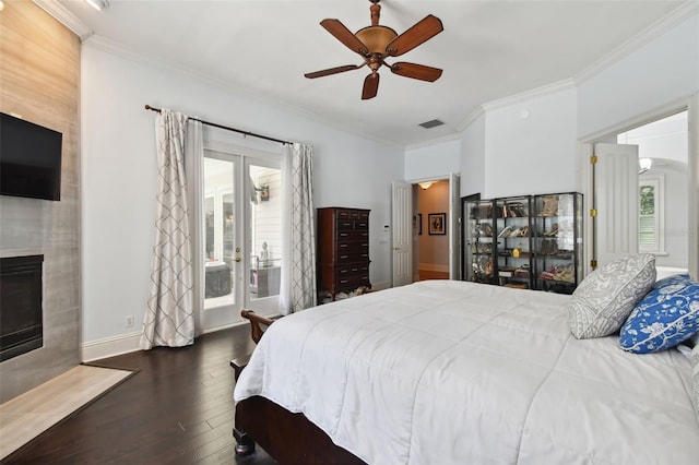 bedroom featuring crown molding, dark wood-type flooring, and french doors