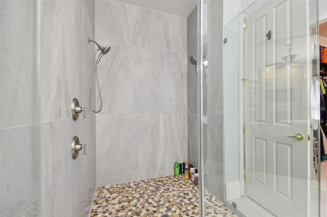 bathroom with a shower with shower door