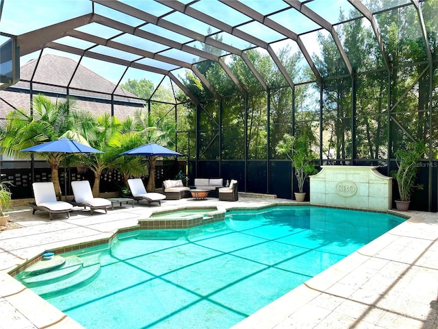 view of swimming pool with an outdoor hangout area, an in ground hot tub, a patio, and glass enclosure