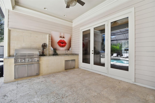 view of patio / terrace with an outdoor kitchen, a grill, sink, and ceiling fan