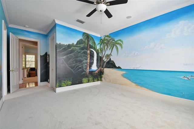 interior space with ornamental molding, ceiling fan, and carpet flooring