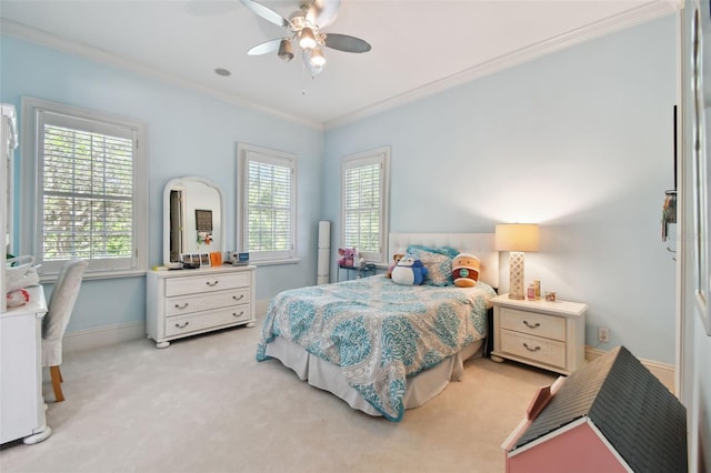 bedroom featuring crown molding, light colored carpet, and ceiling fan