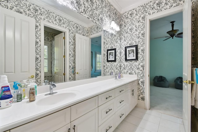 bathroom featuring vanity, tile patterned flooring, ornamental molding, and ceiling fan