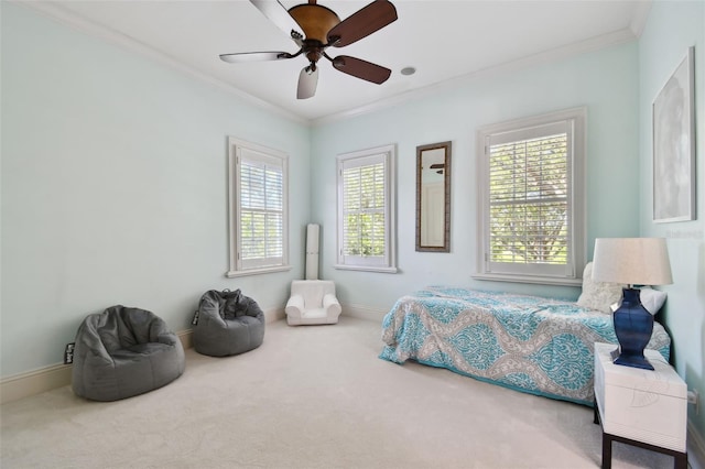 carpeted bedroom with crown molding and ceiling fan