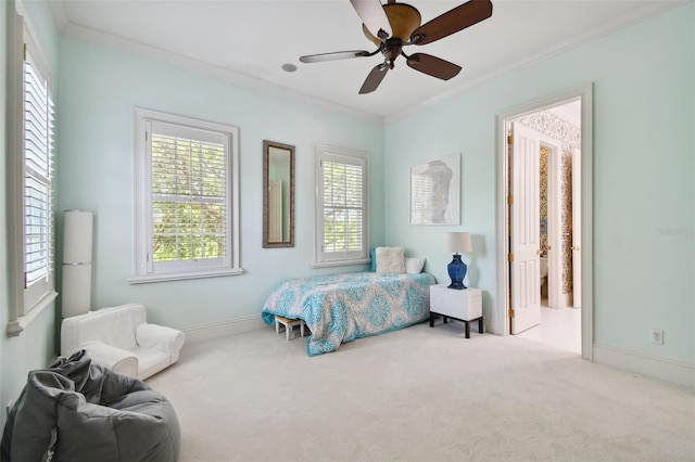 bedroom featuring ceiling fan, ornamental molding, and light carpet