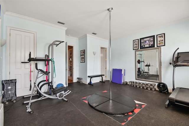 exercise room featuring ornamental molding