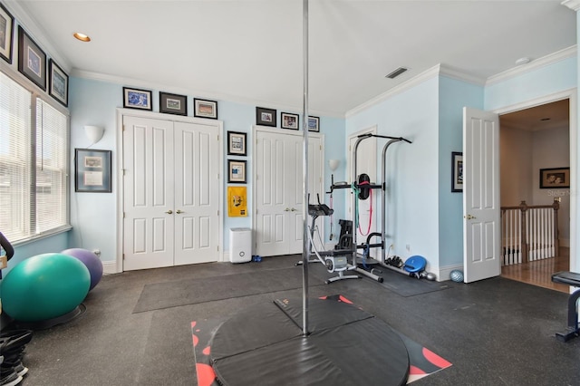 exercise room with ornamental molding