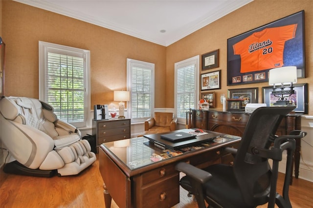 office area featuring ornamental molding and light hardwood / wood-style floors