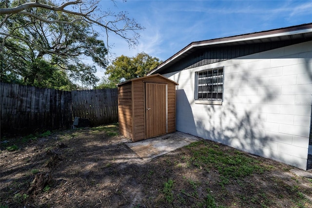 view of shed featuring a fenced backyard