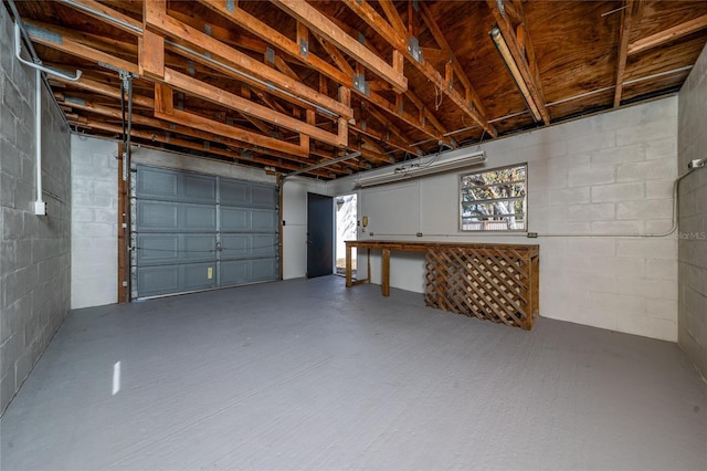 garage featuring concrete block wall