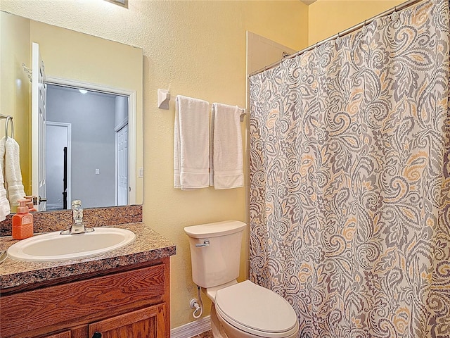 full bath featuring toilet and vanity